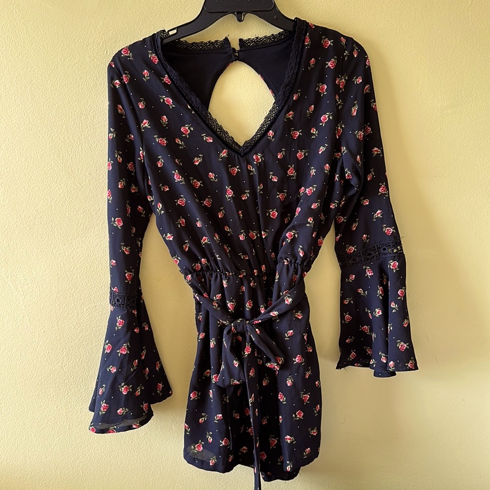 Black long sleeved romper with bell sleeves